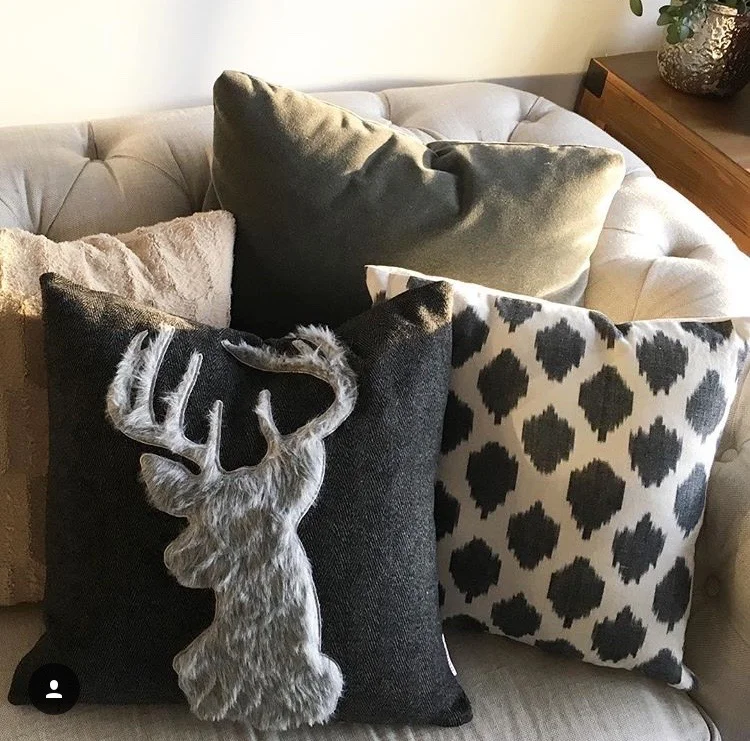 My new favorite reindeer pillow (from Homegoods) on the sofa