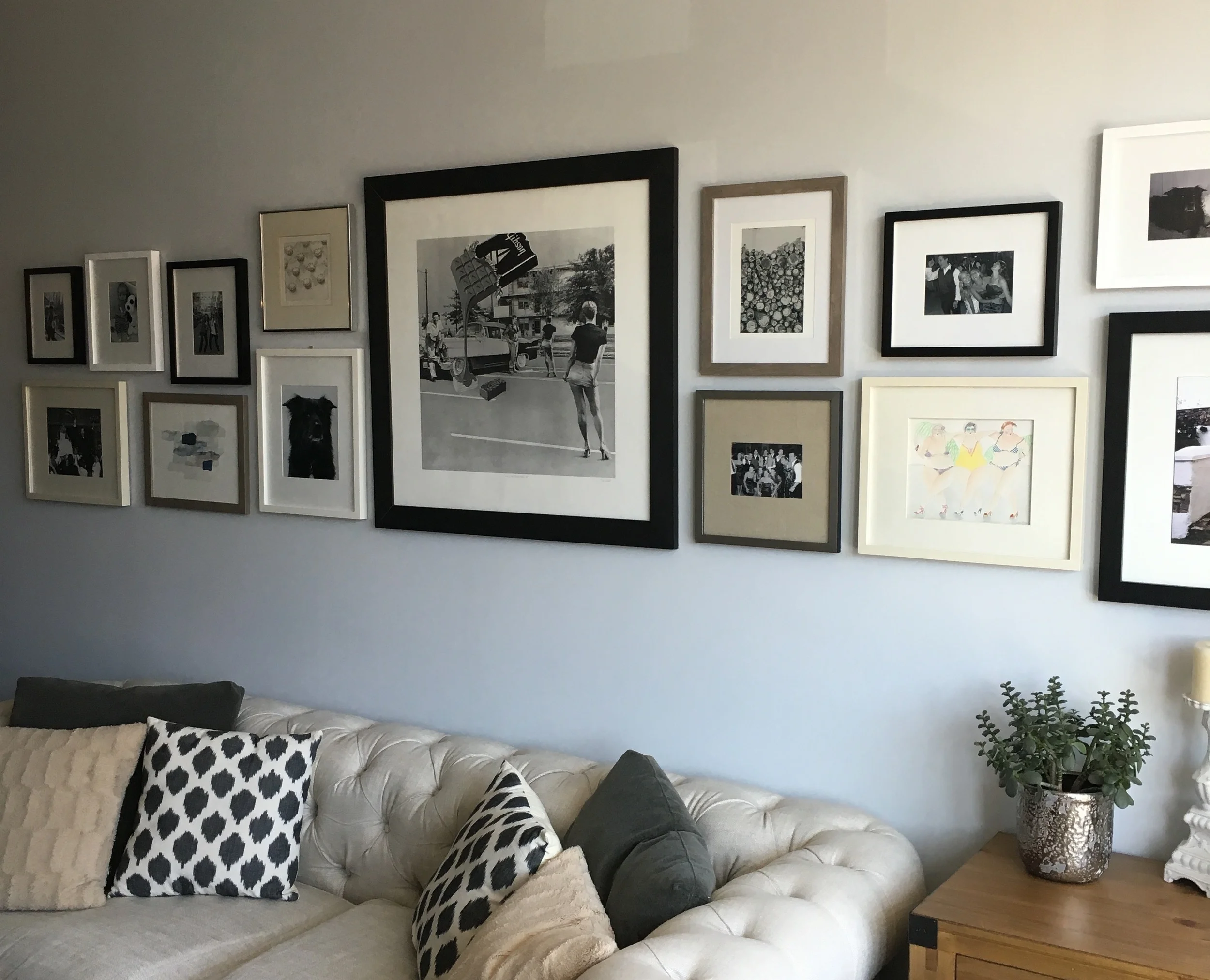 AFTER: A unique gallery wall featuring some of our favorite photographs and artwork.