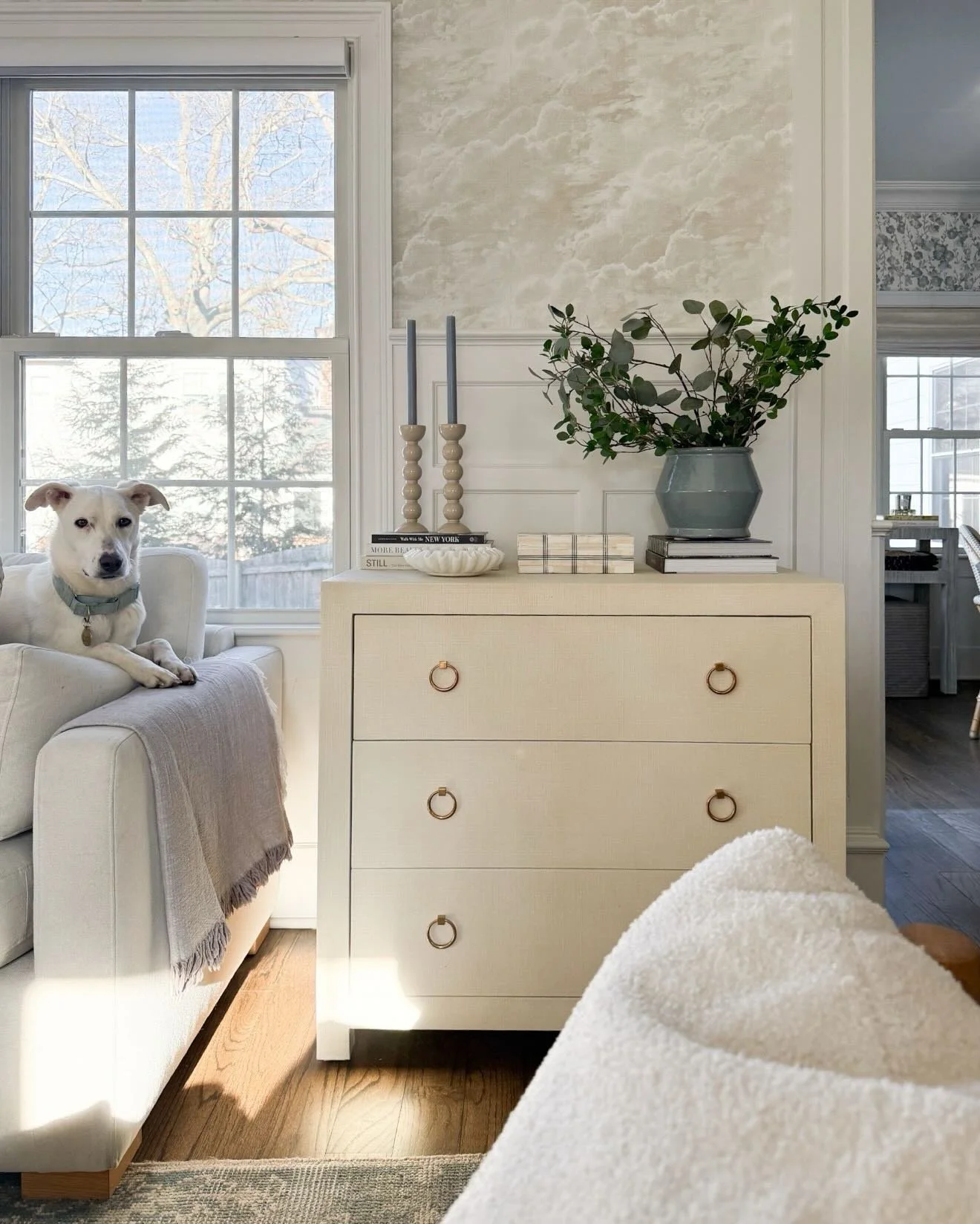 My trick for keeping our home clutter-free is including storage pieces wherever possible. In our living room, we used to have a small side table here that didn&rsquo;t do too much for us. I moved it to another room and replaced it with this small dre