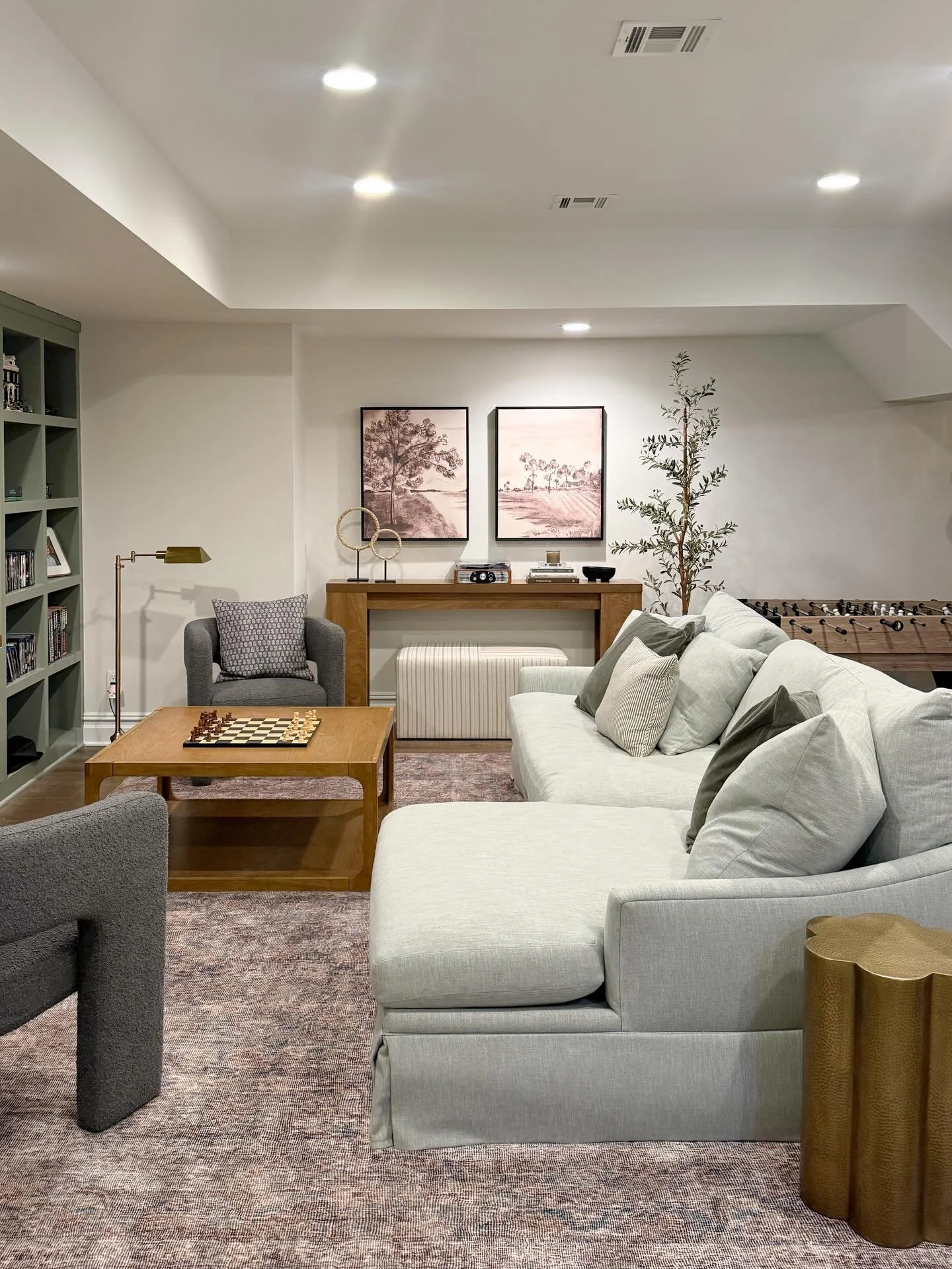 A peek at our basement media room and a true mix of high and low&hellip;

The softest Cloudpile rug, performance sectional and boucle arm chairs ground the space, and then I layered in some affordable accents (you won&rsquo;t believe the price of thi