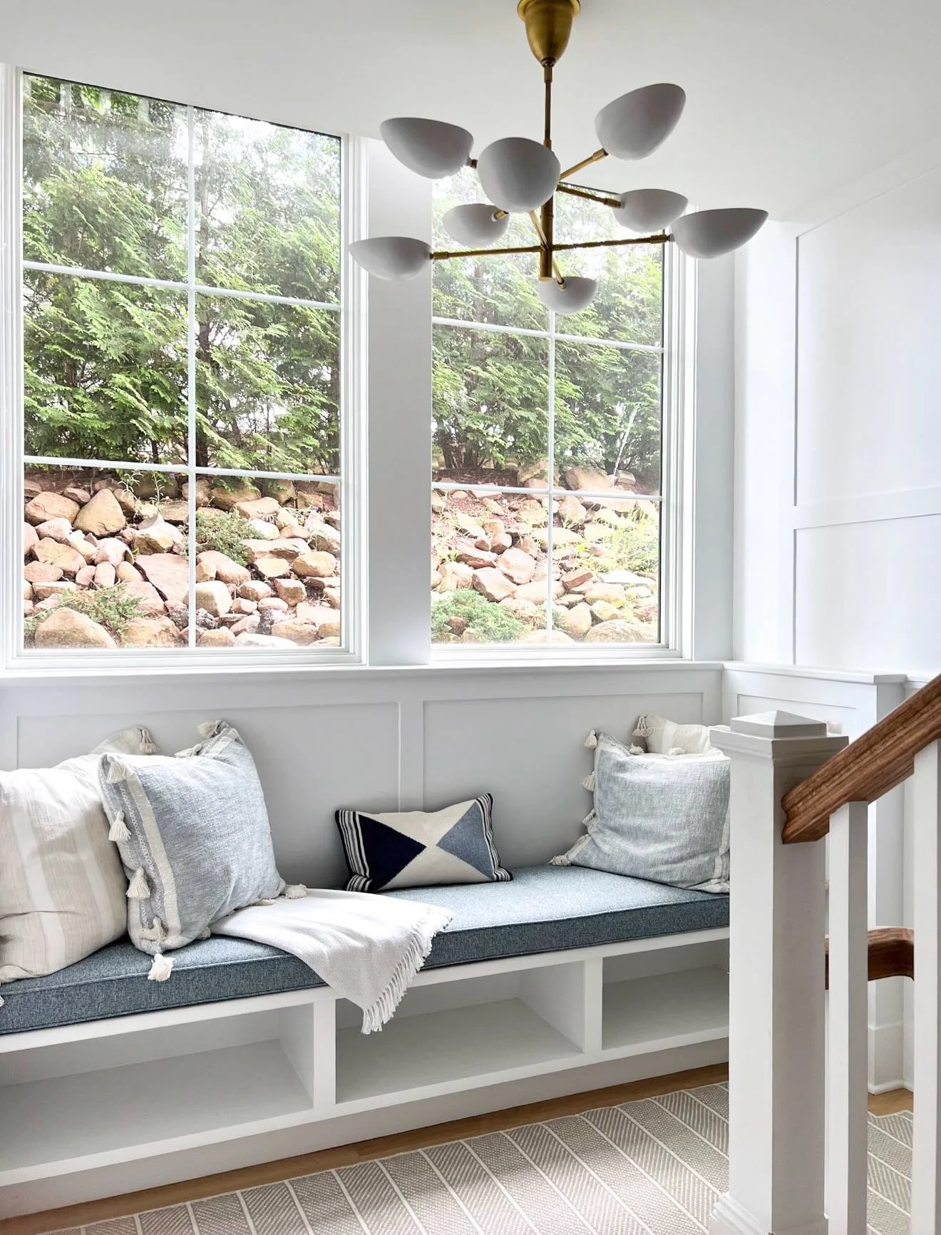 Sometimes a staircase needs its own little moment ✨

This stairway has the most incredible natural light so we wanted to create a cozy nook where the family could sit and read or simply hangout. A custom bench with cushion, a bunch of throw pillows a