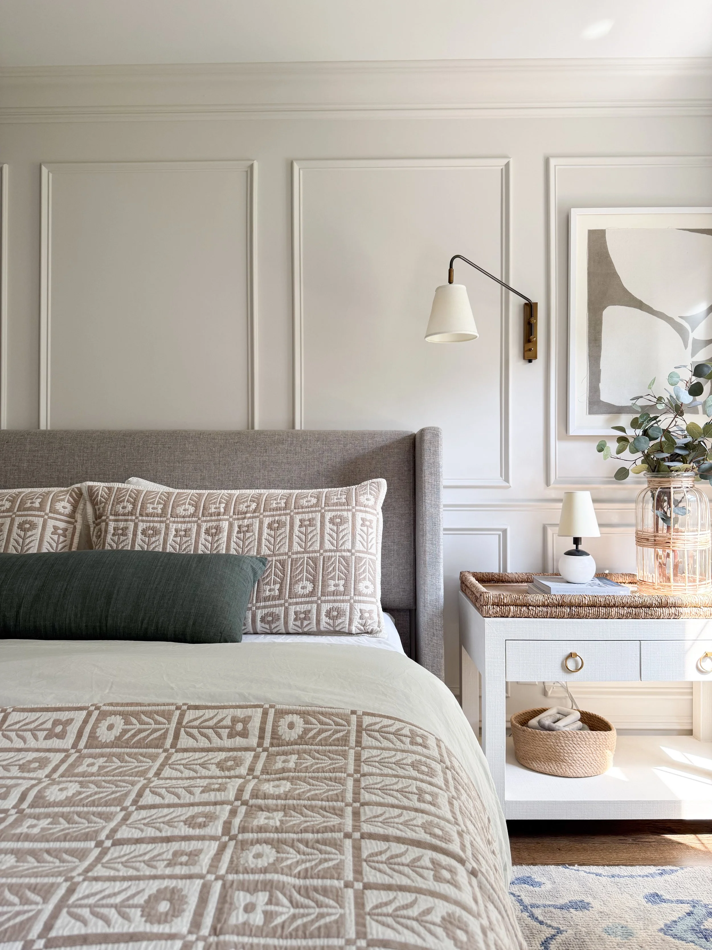 Styled bedroom with Quince linen duvet cover, floral quilt, and neutral bedding creating a timeless and inviting bedroom design.