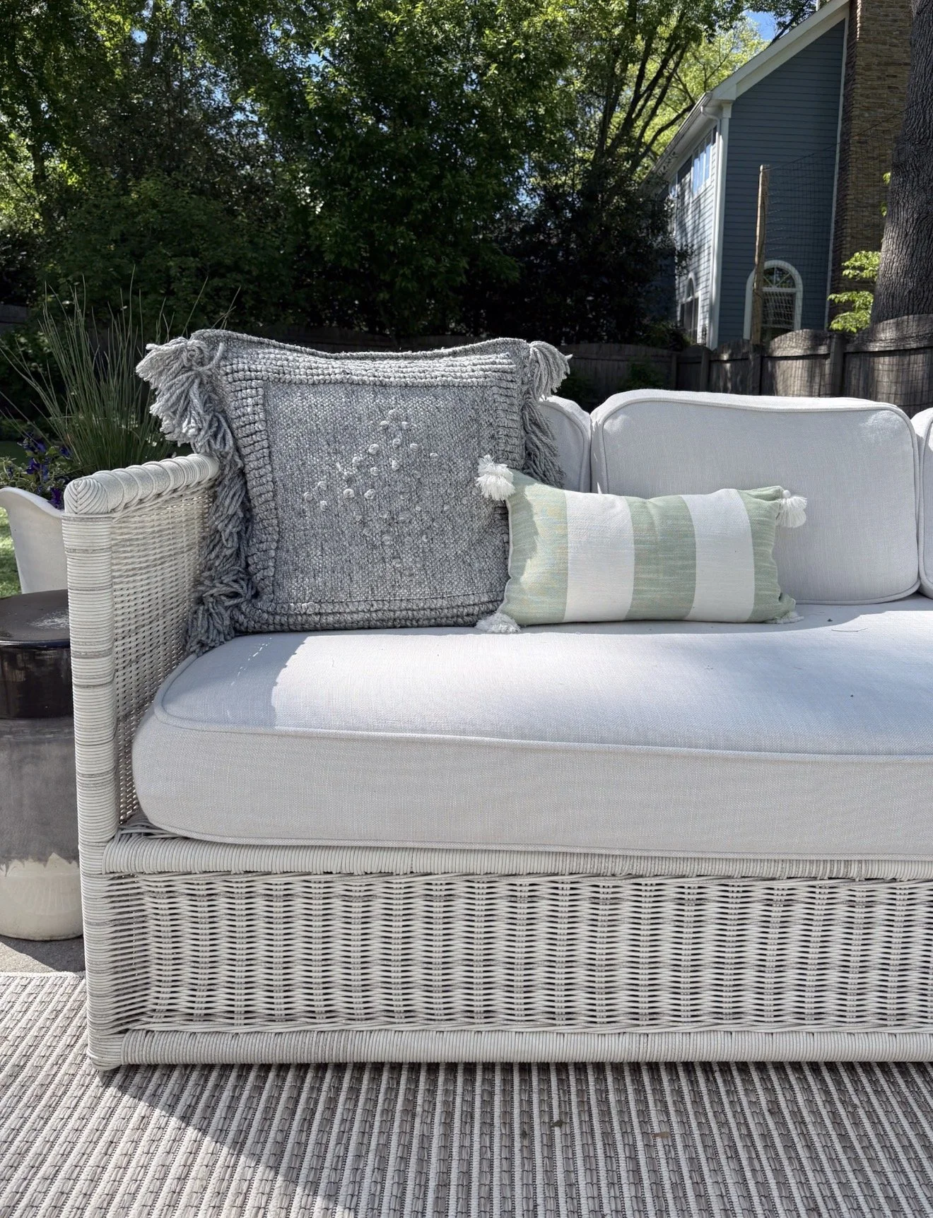 Serena & Lily Pacifica outdoor sectional on a patio with woven seating, plush cushions, and outdoor entertaining space.