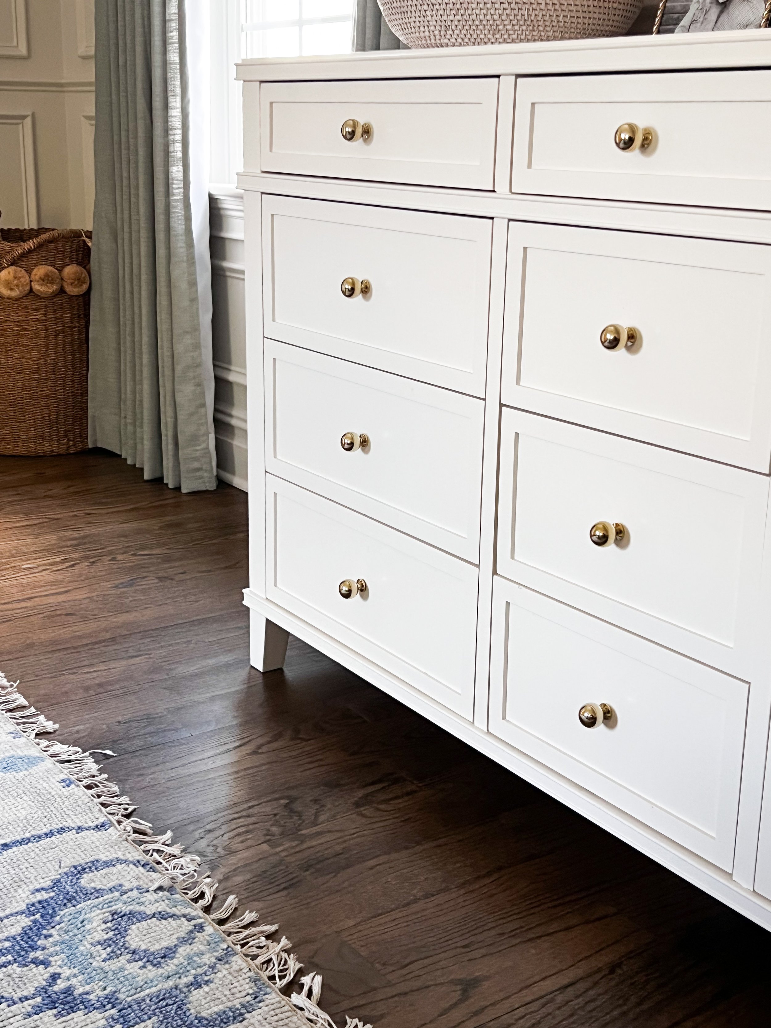 Amazon Prime Day home upgrade featuring polished brass cabinet knobs used to update a white dresser with a custom look.