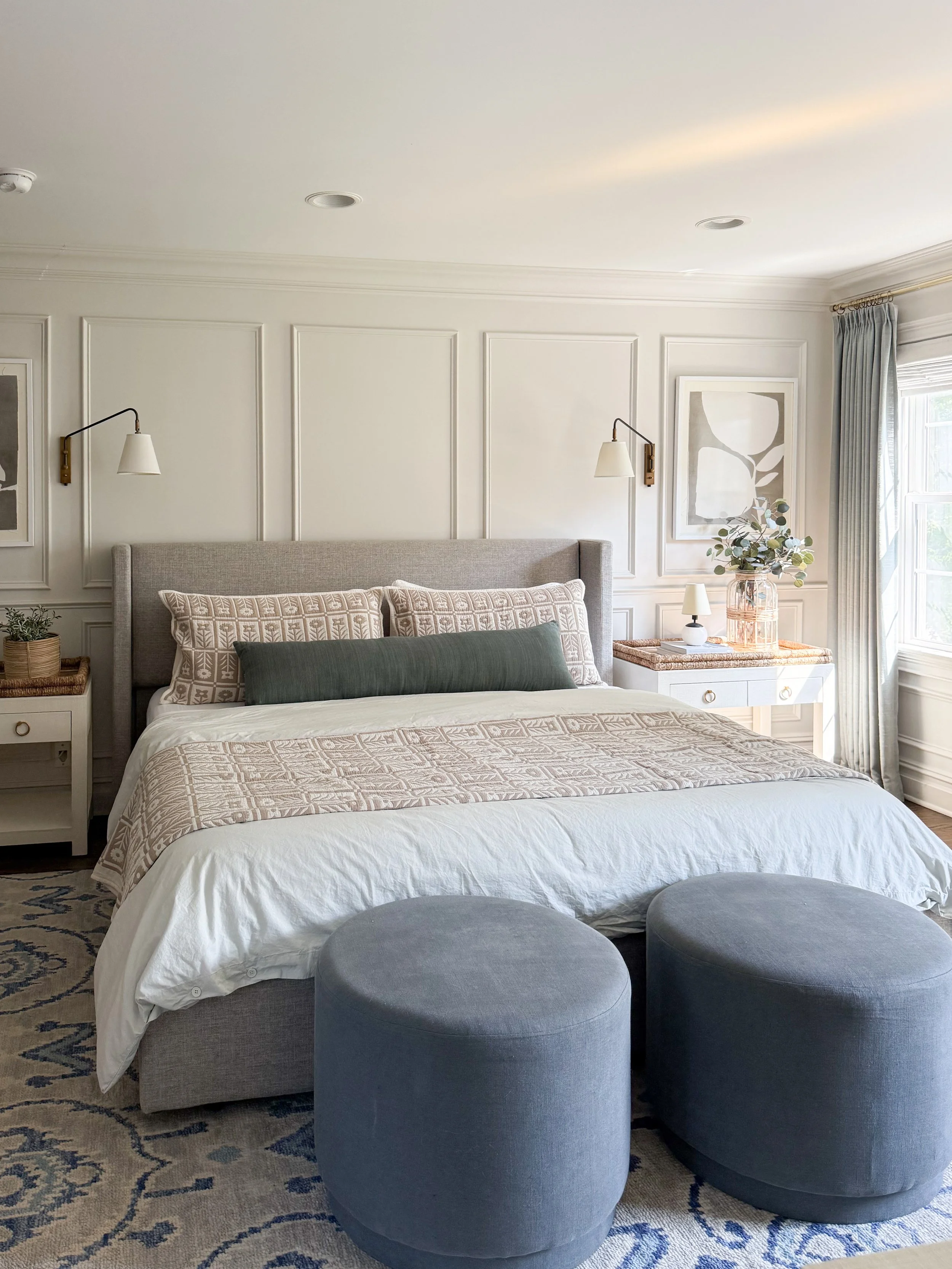 Bright neutral bedroom featuring Quince linen bedding, a floral quilt, matching shams, and layered pillows for a cozy bedroom refresh.