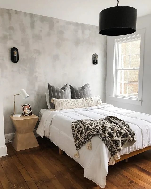 The walls in this house😍 The concrete look in this master suite was accomplished using a painting technique, and adds just the right texture and depth to the room.