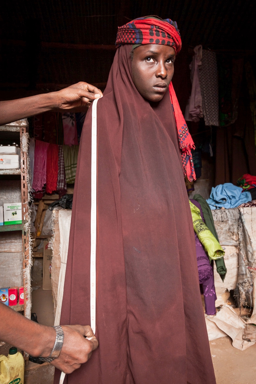  A tailor measures Habiba for new clothes in advance of her wedding; Ethiopia 