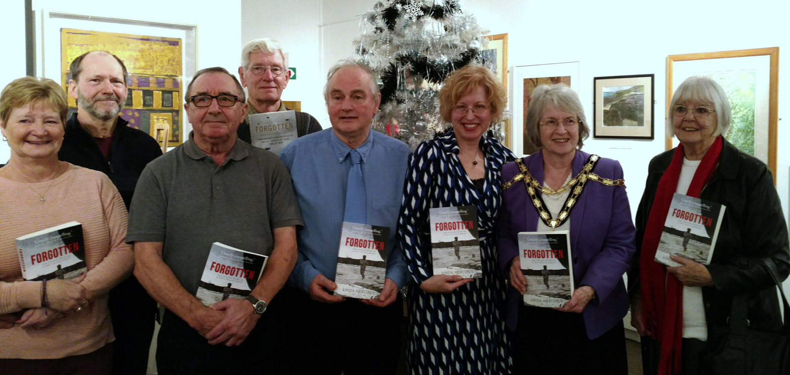 Photo call with VIPs and friends of Forgotten at the Pontypool Museum. From left, Cheryl Morgan, Robert Prior, David Prior, Ken Clark, Peter Garwood, Linda Hervieux, Torfaen Mayor Veronica Crick, Dot Jones.