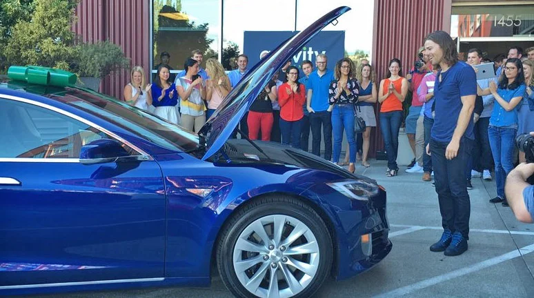 Gravity Payments employees buy a Tesla for their CEO, Dan Price
