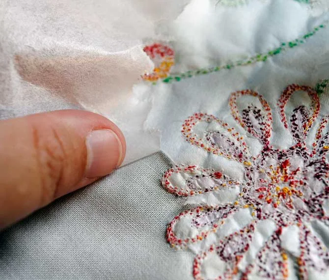 Pulling the interfacing away from the back of the fabric
