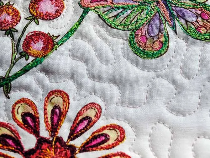 Meander quilting around the thread painting