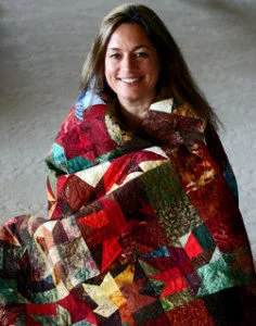 Ana Buzzalino is a fiber artist and quilt instructor living in Calgary, Alberta, Canada.