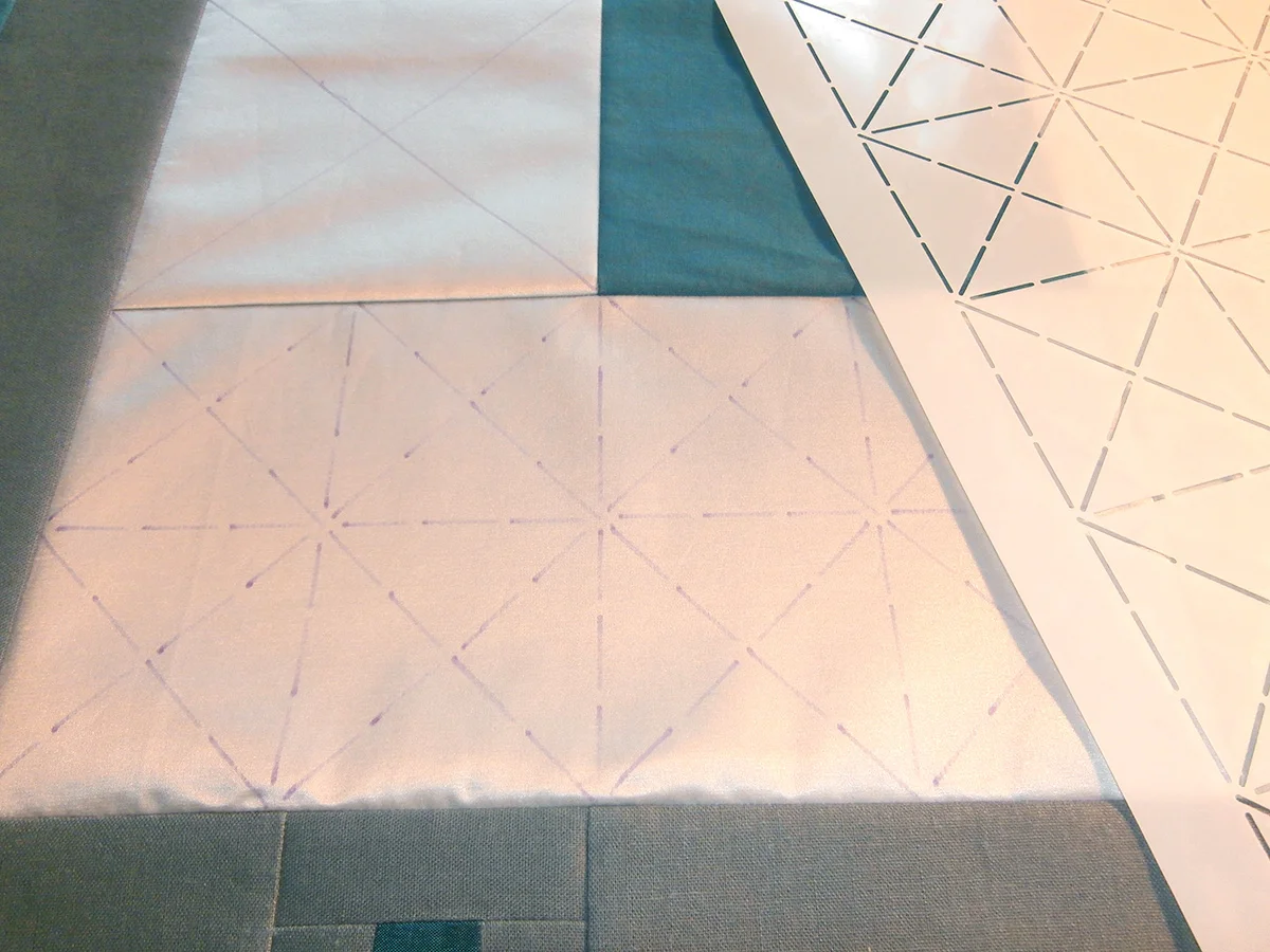 Making the basic design with her Crossed Squares stencil.