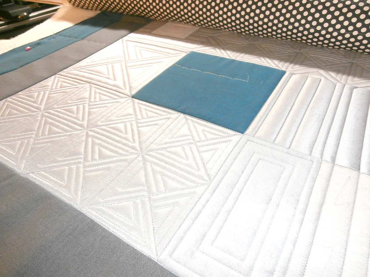 The designs stitched. She will later be adding fills to the design using thinner thread.
