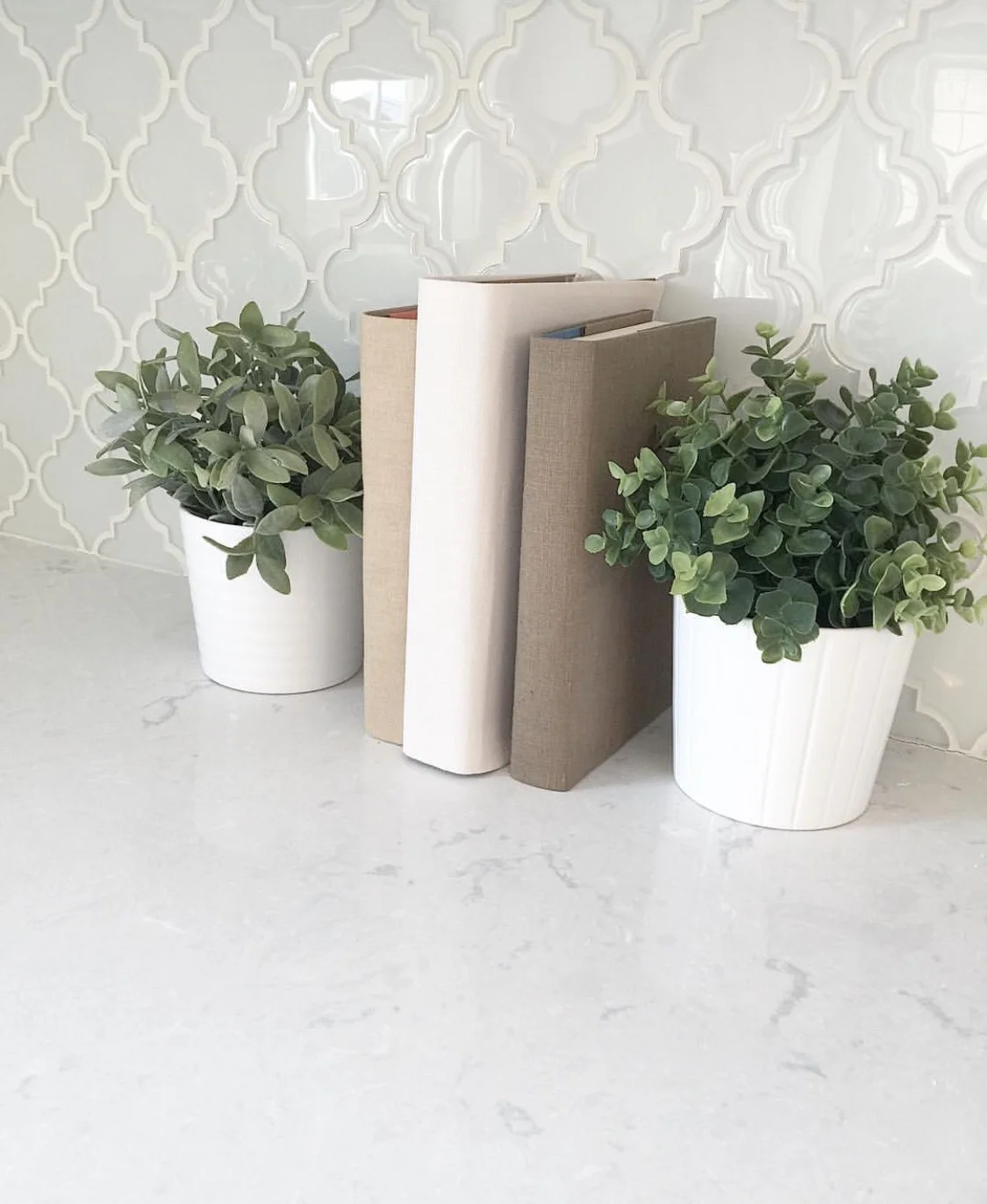 Cambria swanbridge quartz countertops with glass tile backsplash