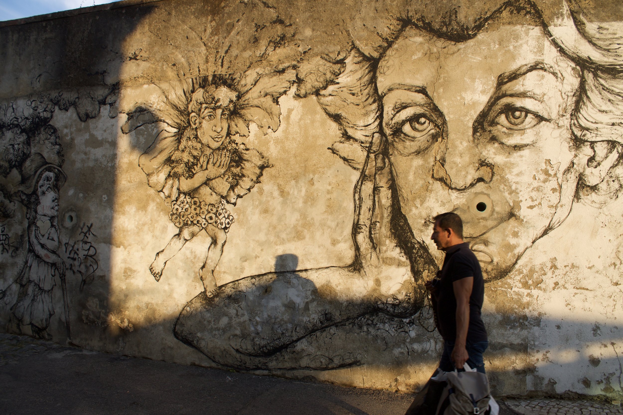 Man with portrait, Graça, Portugal