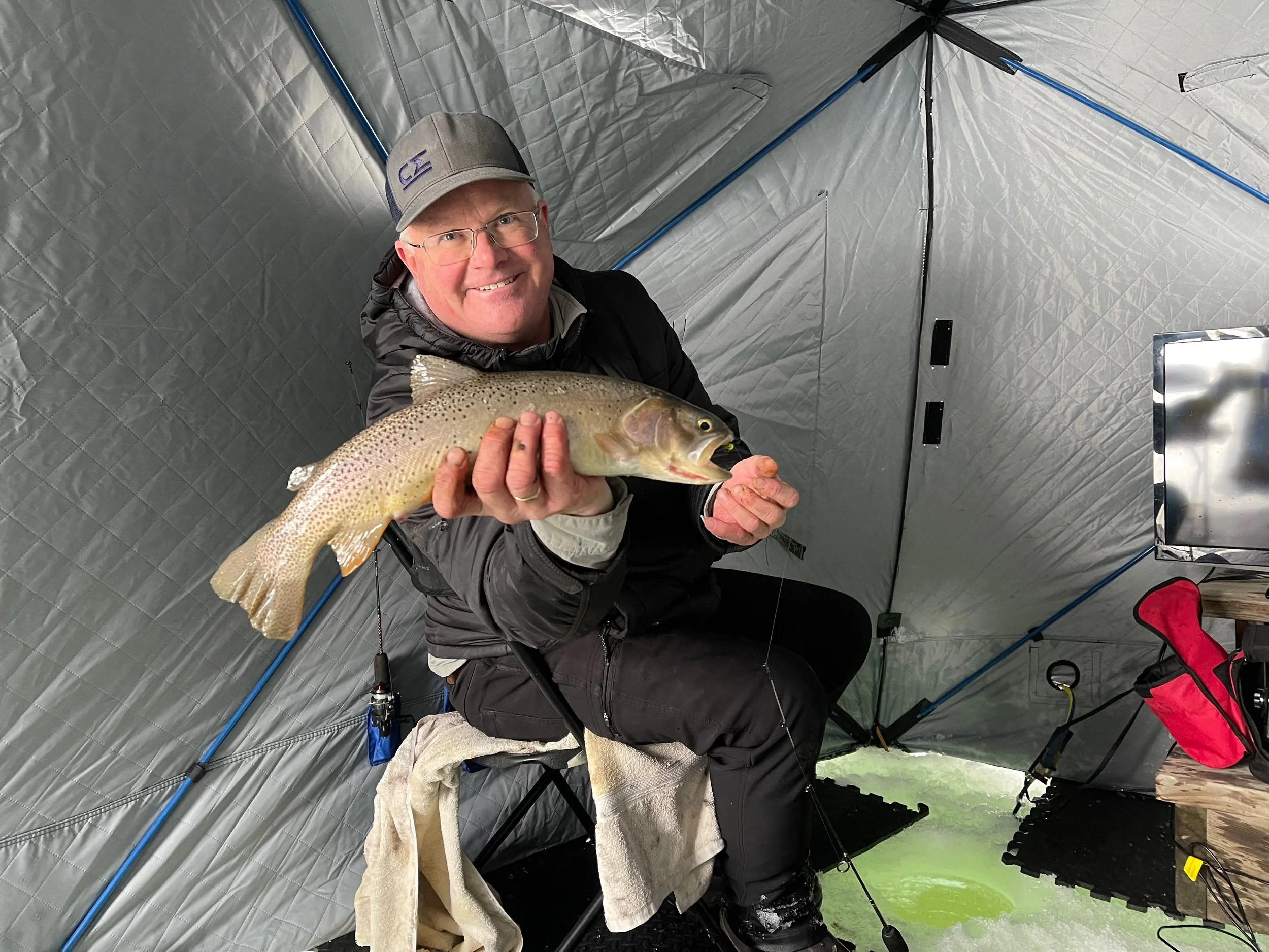 Guided ice fishing shelter set up on Harrison Reservoir near Bozeman, Montana