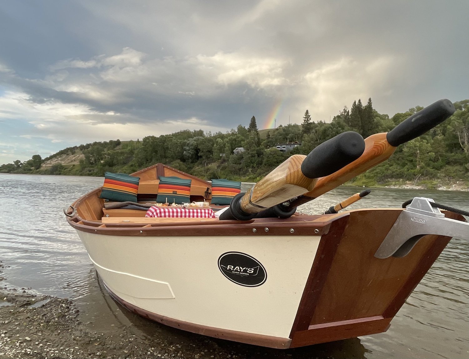 The Joy wooden dory on the Yellowstone River with blankets and food ready for guests