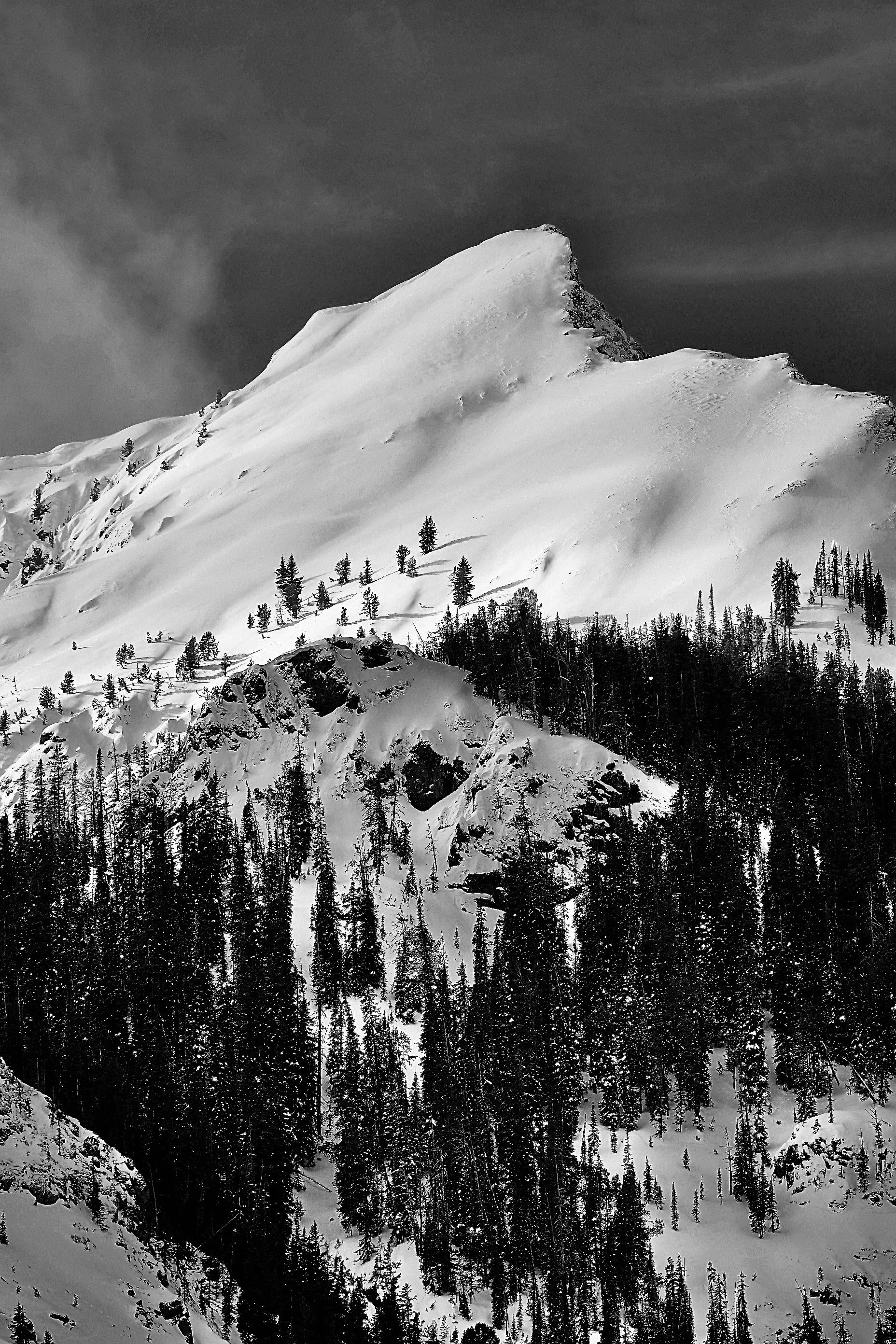 Wind-loaded high alpine snowfield near Cooke City, locally known as the Finn, in Montana’s Absaroka Mountains