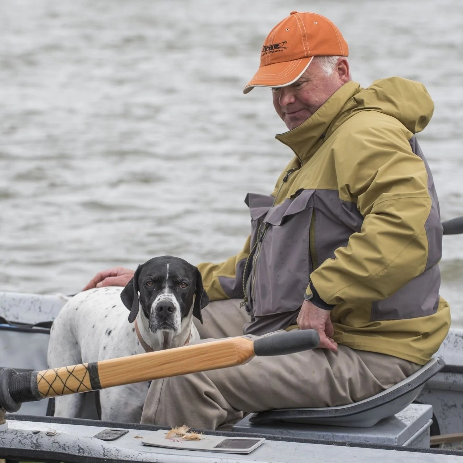 Montana fly fishing guide Matt Swan at the river with his dog.
