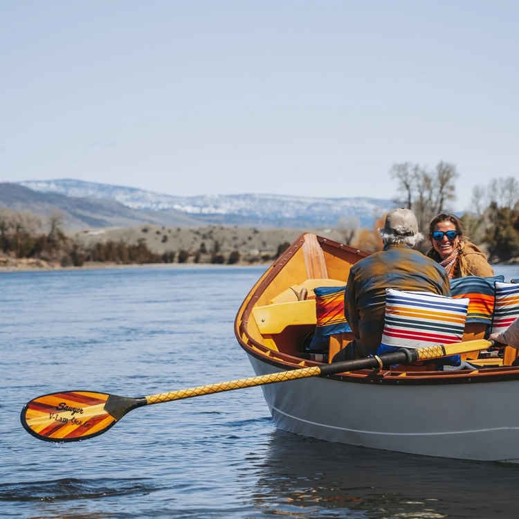Couple on a private wooden boat tour on the Yellowstone River near Livingston Montana