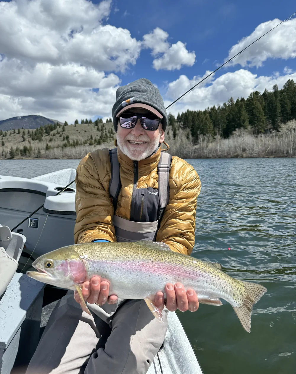 Private wooden dory boat tour on the Yellowstone River through Paradise Valley, Montana — scenic float for couples and families near Livingston and Bozeman.