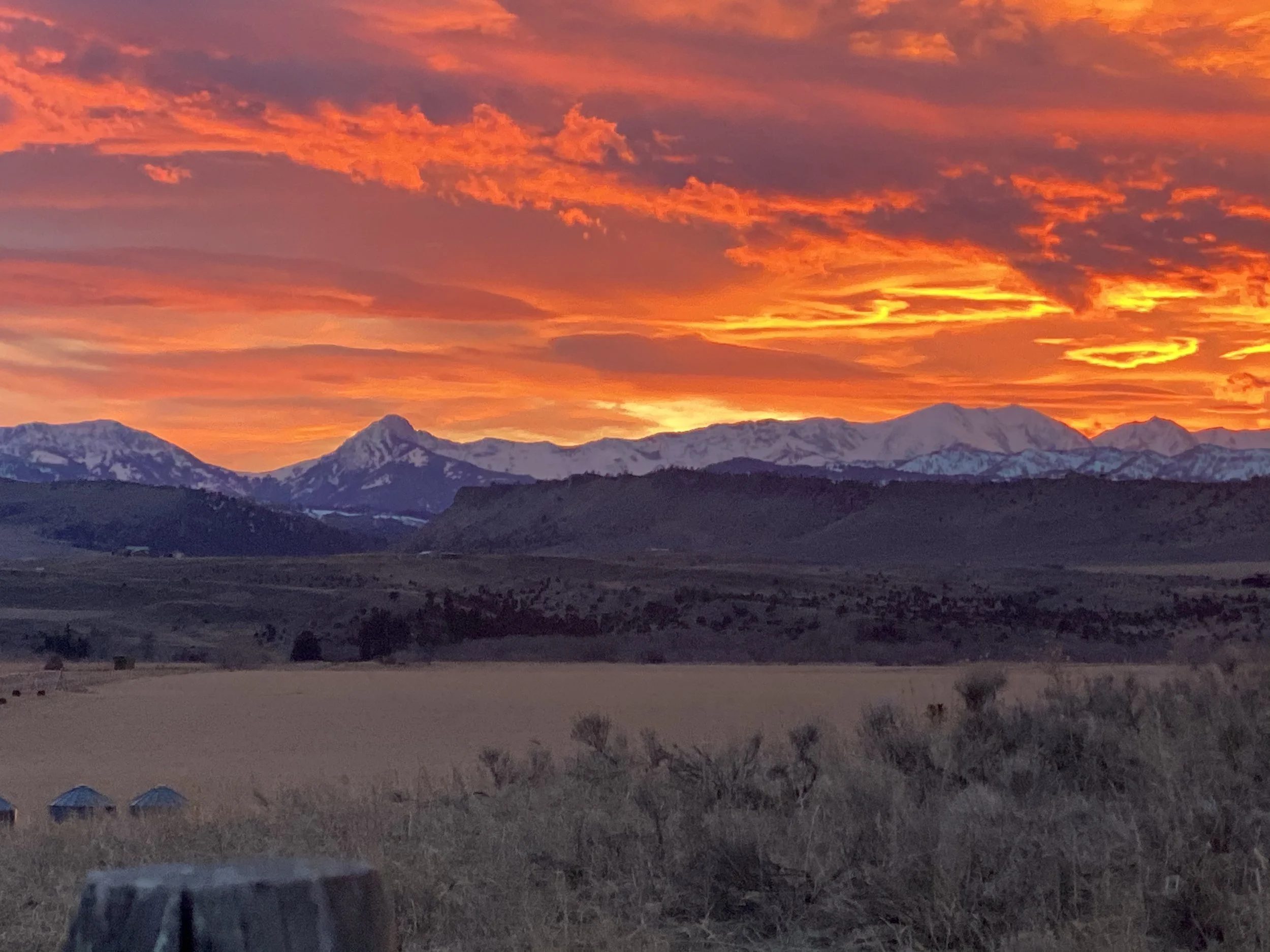 Sunset over Montana mountain ranges near Clyde Park, showing the steady landscape that frames Yellowstone River fly fishing