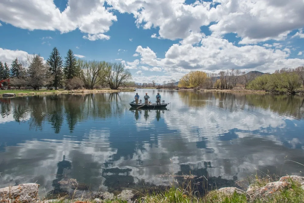 Anglers fishing DePuy's Spring Creek under a big Montana sky