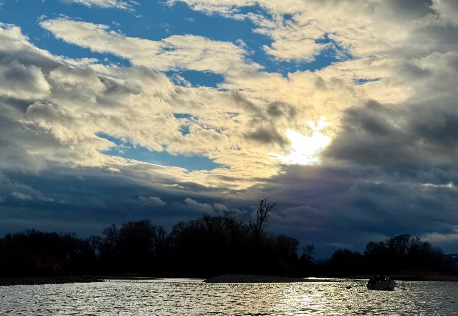 Handcrafted wooden drift boat on a winter scenic tour along the Yellowstone River in Paradise Valley, Montana
