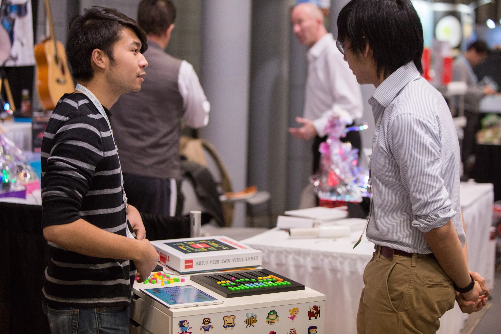 Richard talking with a potential retailer. Photo by Elizabeth Wiseman Photography.
