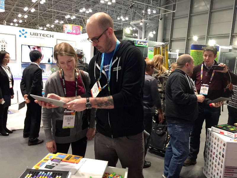 Daniel demoing a game and Josh taking an interview with a writer.