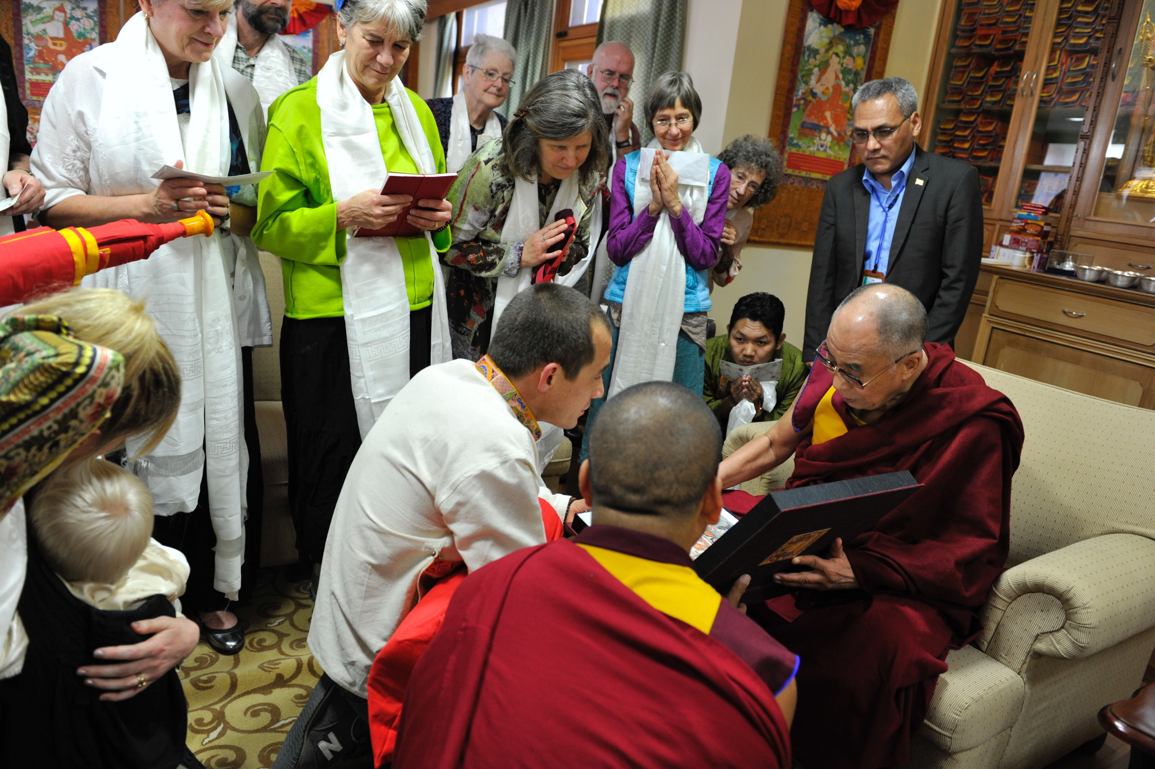 His Holiness the Dalai Lama receiving the first copy of Celestial Portfolio