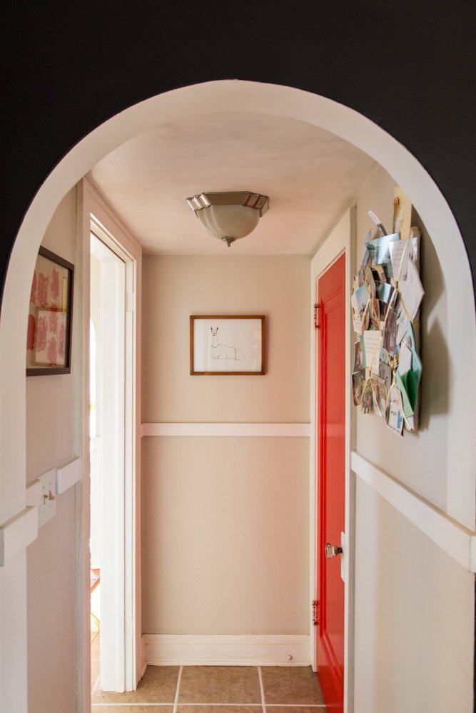Image via Apartment Therapy. Paint color for door: Behr Flirt Alert