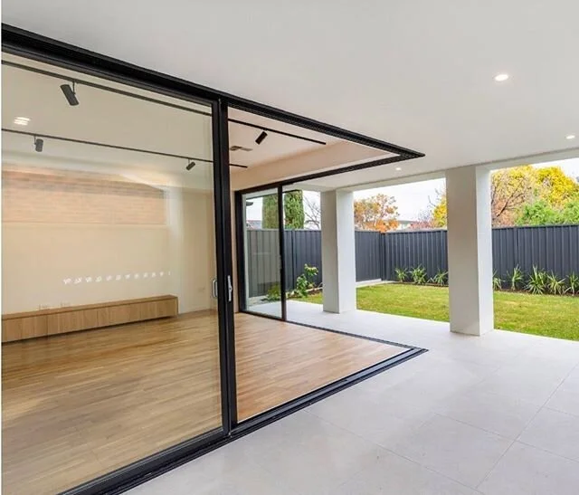 Floor to ceiling corner stacking door for our Blackforest project. #imperiumconstructions