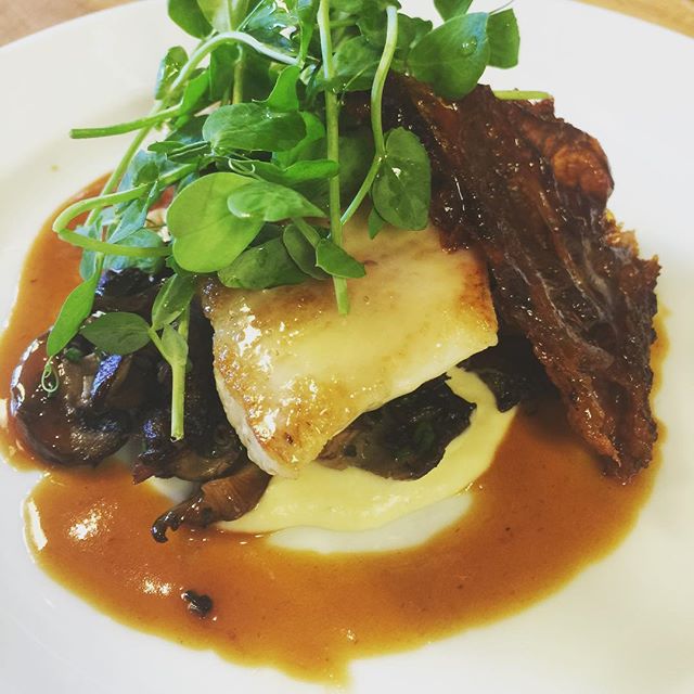 Peek under the pea shoots: layers of flavor in every dish. Photo cred: Dylan Allwood