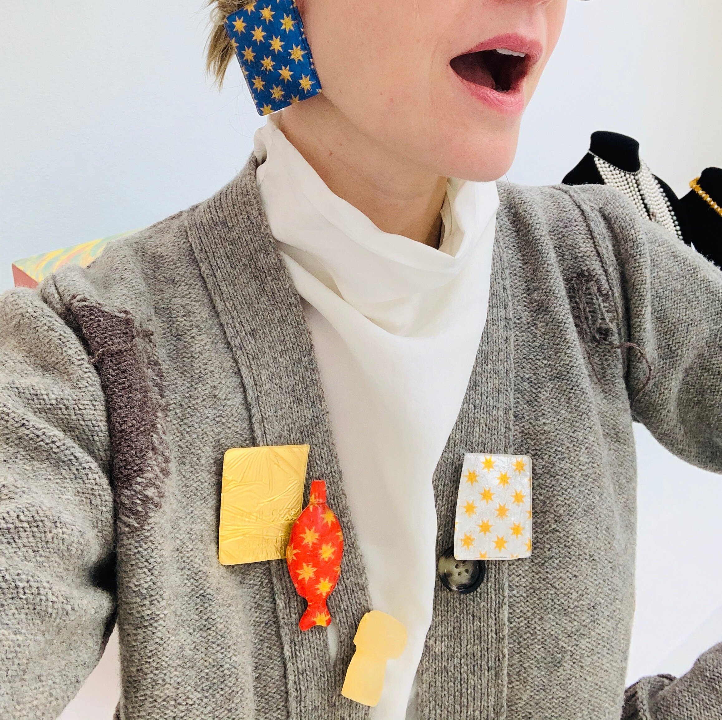  Ligia Dias, CESAR (credit card, soya fish, champagne cork stopper), 2017/19, brooches and earring, resin, chocolate paper, gold leaf, metal, silver. Photo Fabienne Stephan   Shop CESAR   