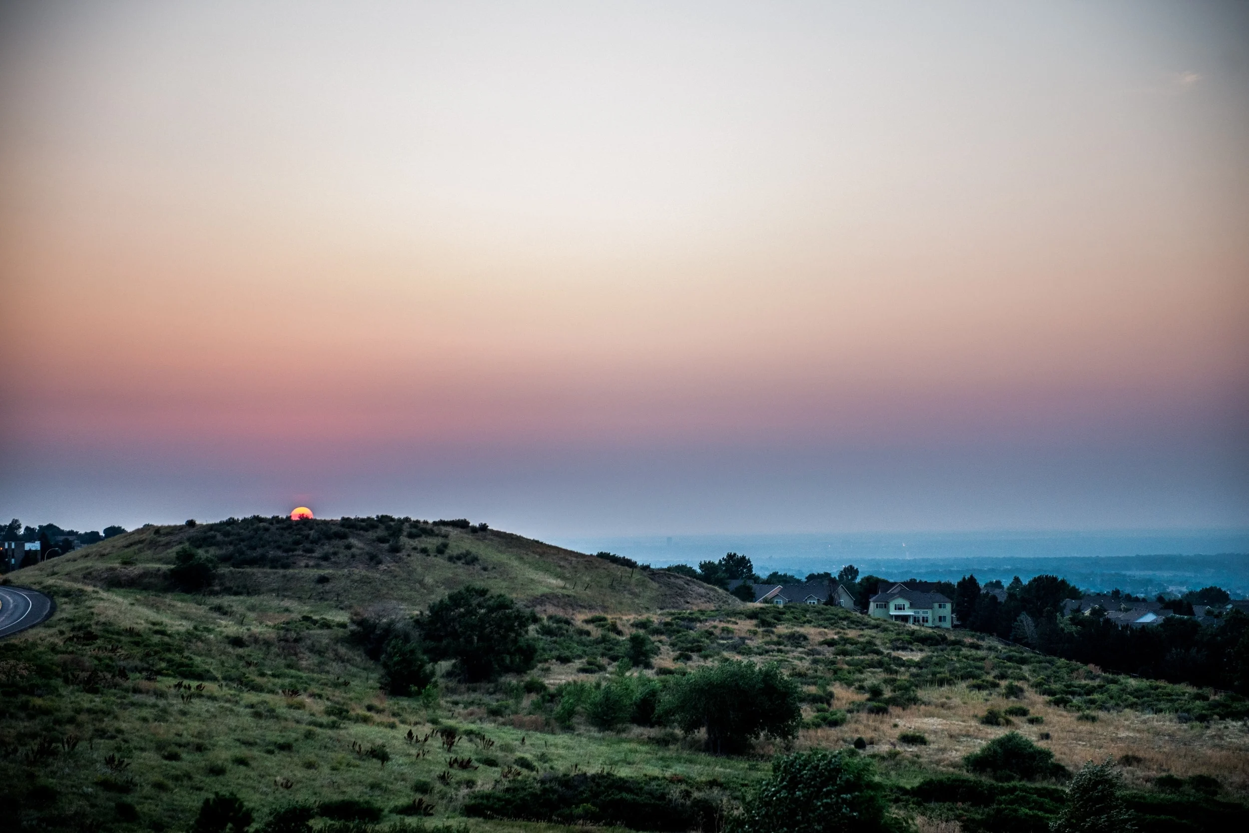 Sunset comes to the foothills of Solterra in Lakewood, CO
