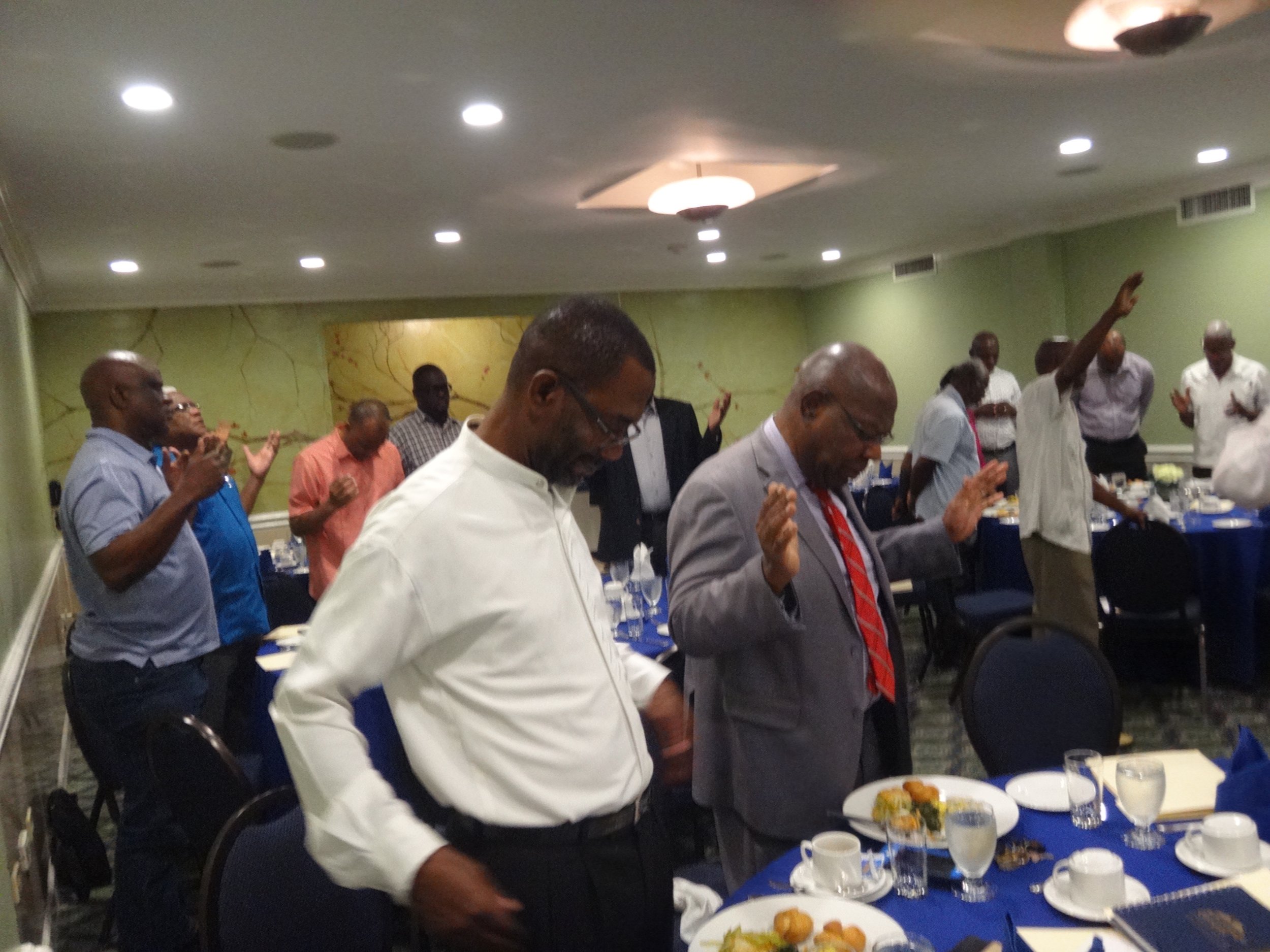 Pre-Congress participant praying
