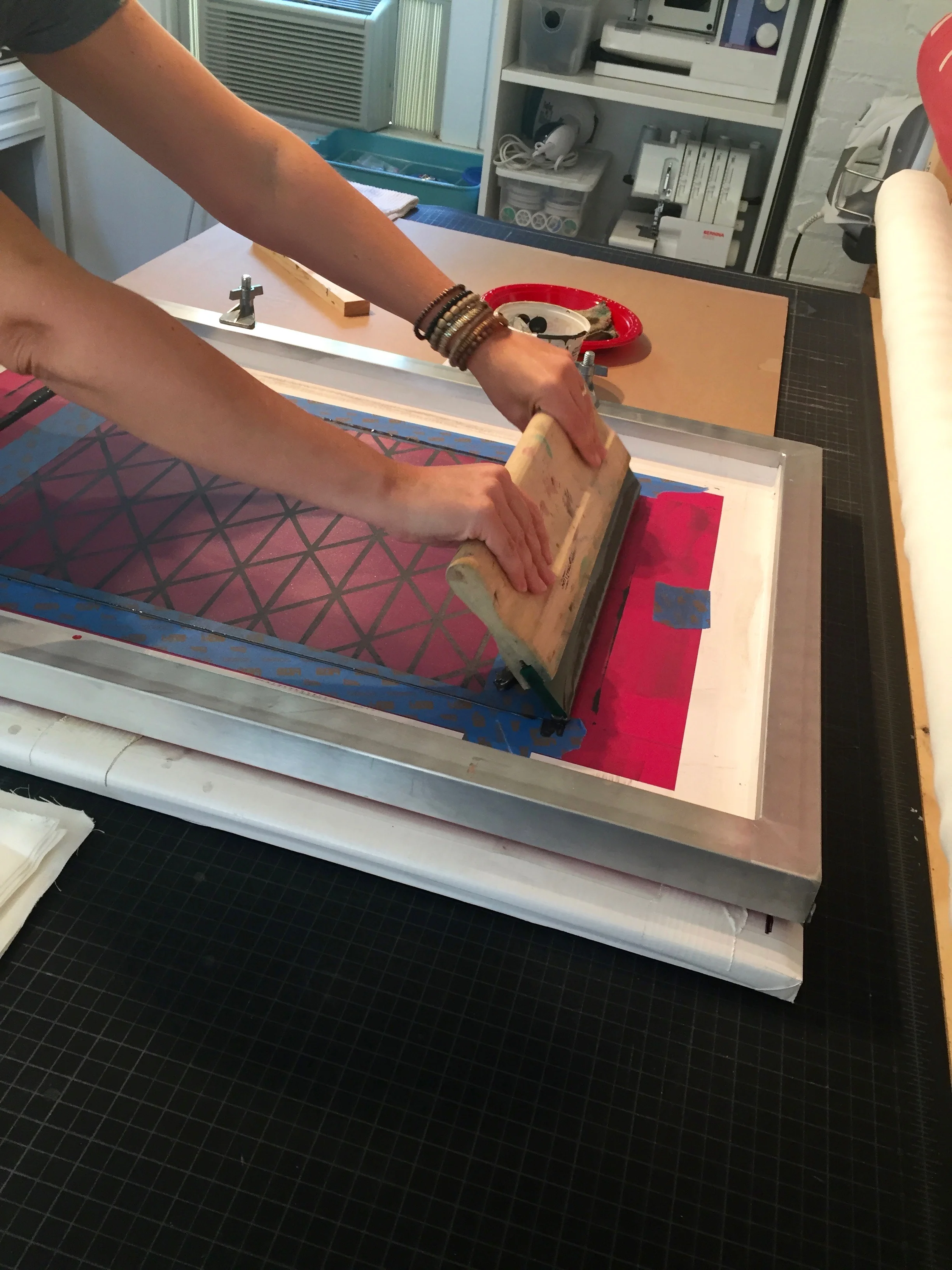 Working the ink through and pressing into the fabric