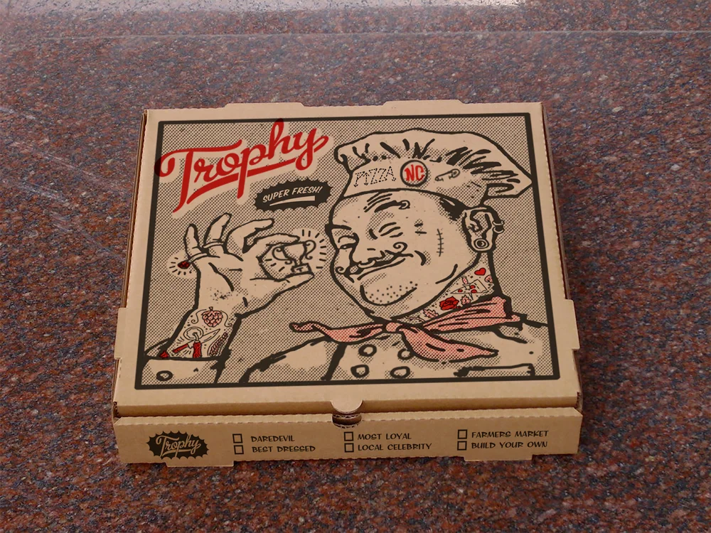 1. This is a funny twist on the old pizza boxes and imagery that feature the classic chubby Italian pizza chef (basically giving him a makeover to reflect what you would expect to see in modern kitchens). This direction could produce some nice little secondary graphics like the ring, button and tattoos that could be spread around the rest of the areas on the box or even napkins or ADs.