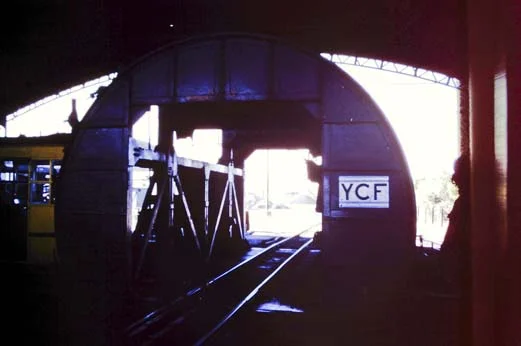 Rotary dump narrow gauge. Like many modern coal-hauling railroads, the RFIRT employed coal gondolas that were dumped using the rotary dumper shown above - each railcar is emptied by being flipped upside down.