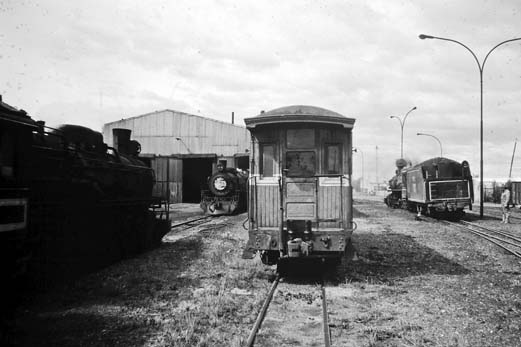 Narrowest passenger car ever? This photo by Anderson shows one of the few passenger railcars maintain by the RFIRT. In the background, locomotive 101 is performing switch movements prior to assembling the train they took from Rio Gallegos to the mine at Rio Turbio.