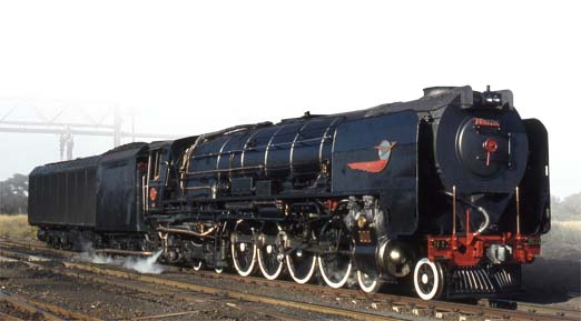 This 1981 image by Malcolm Best shows Condensing 25 Class locomotive 3411 taking on water at Hartswater, SA.