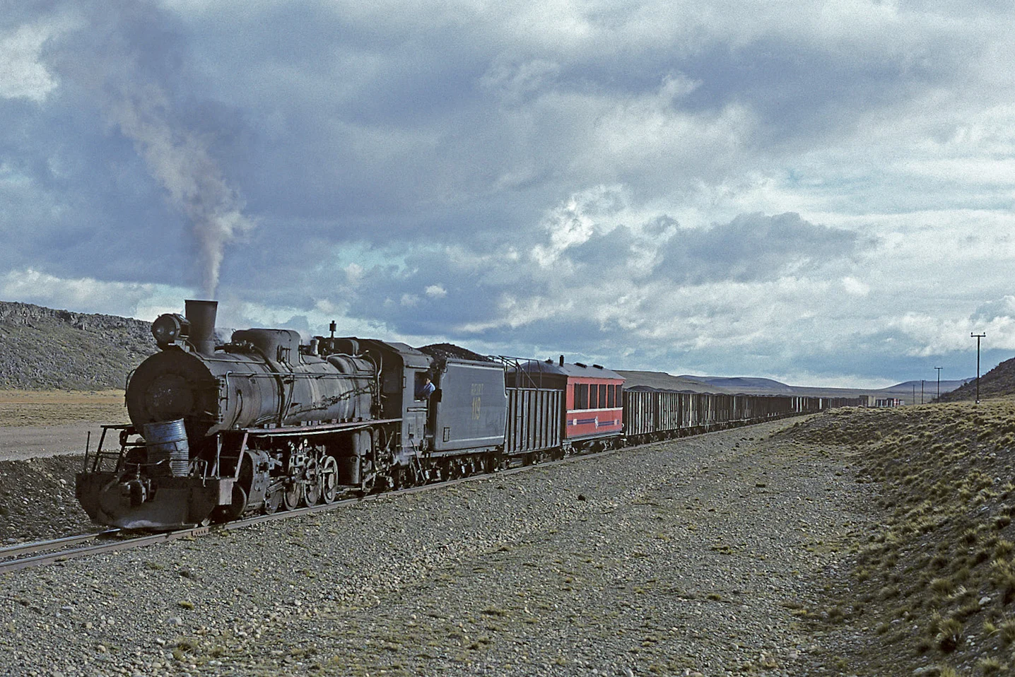 This photo by William E. Botkin shows RFIRT 119 hauling a train in 1996; it is currently one of two locomotives being rebuilt in Buenos Aires.