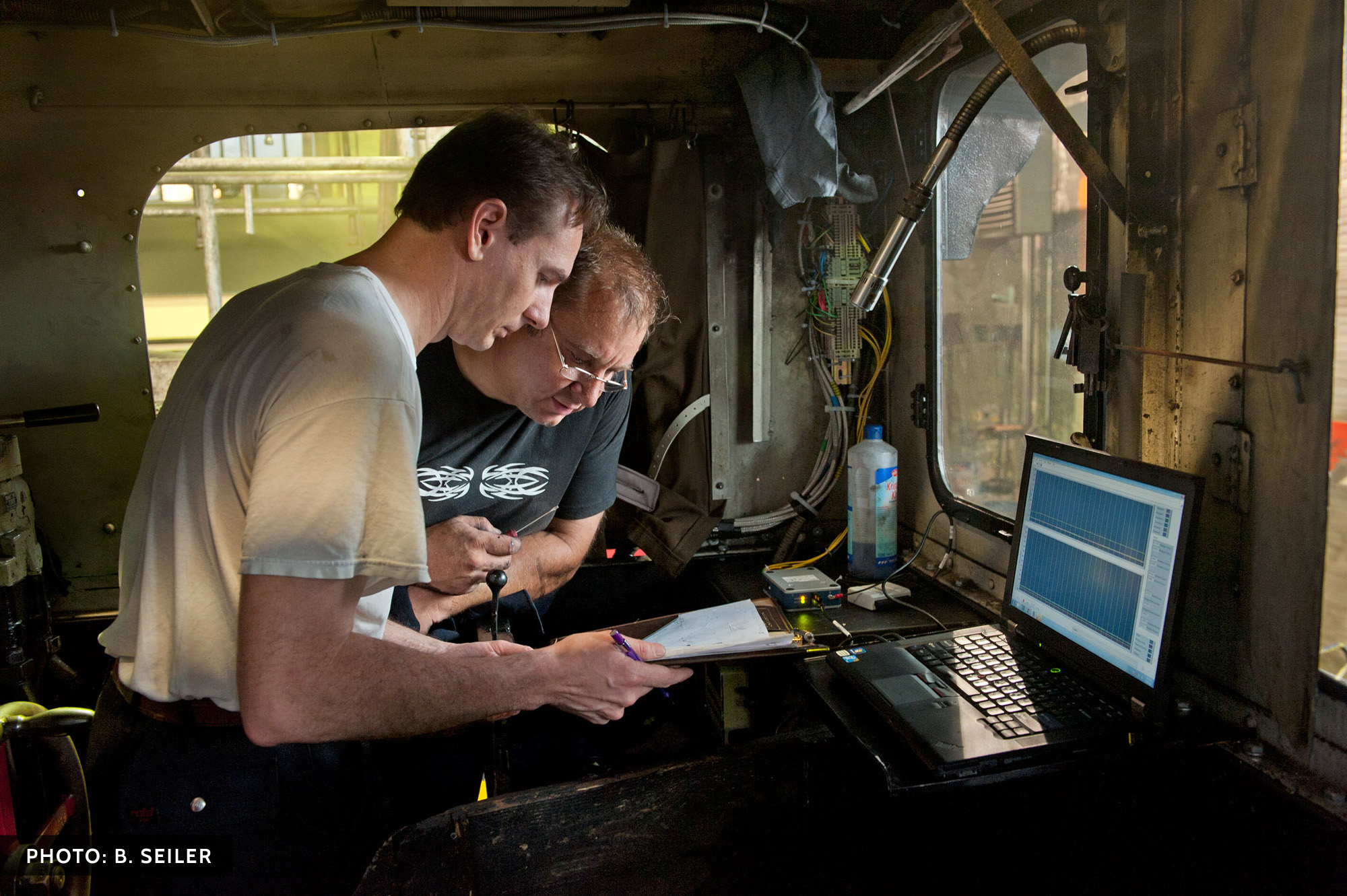 19th Century meet 21st Century- W. Fengler and H. Trieglaff compare notes in the Wernigerode Locomotive facility on July 30, prior to beginning test runs.