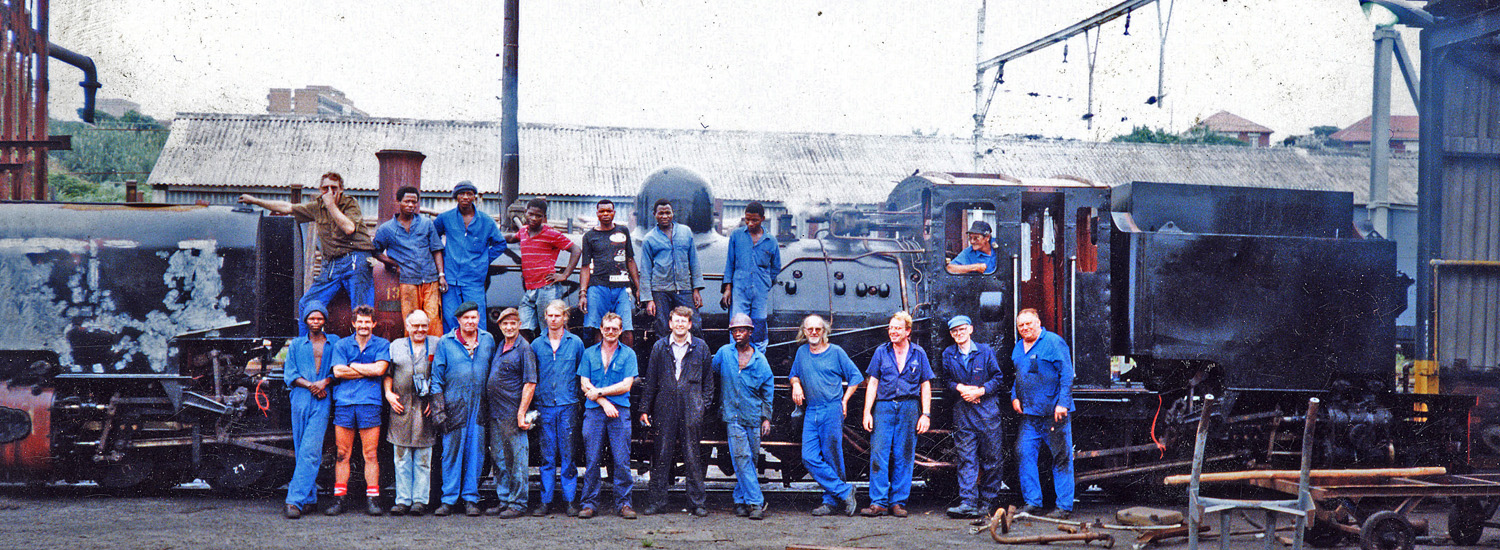 Girdlestone (middle with arms crossed) and the shop crews at ACR stand before locomotive 138 in February 1996. Photo: collection of S.T. McMahon