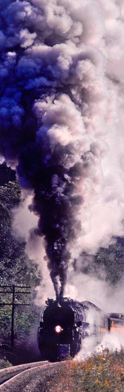 Coal-burning C&O 614 pulls a train with all its might, blasting smoke out of the stack as it slows to a stall in Miflin, Pennsylvania, on September 28, 1980. Photo by John F. Bjorklund and Courtesy of the Center for Railroad Photography & Art.