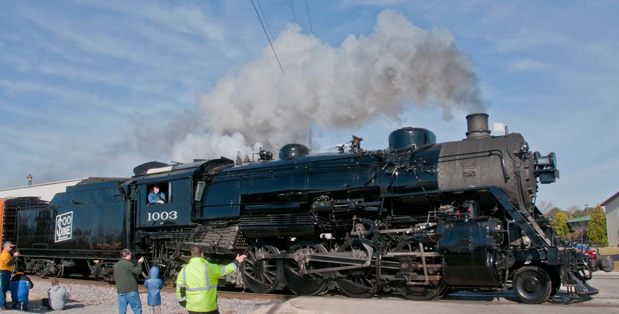 Ken Ristow is at the throttle of Soo Line 1003 as it races towards Hartford, Wisconsin, for its annual Christmas display in November 2015.