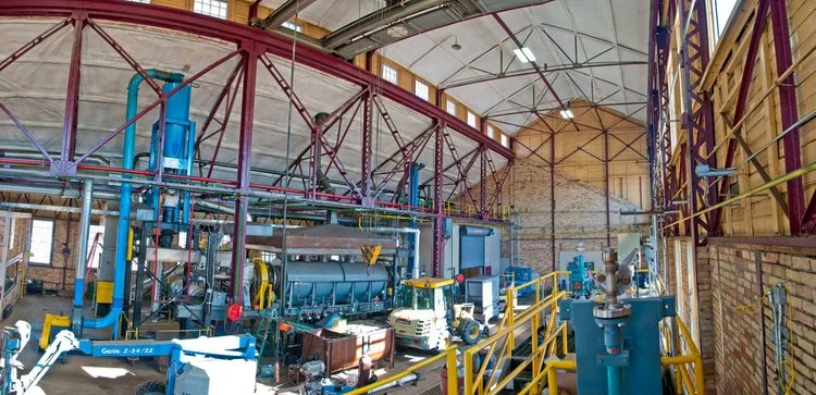 The Biofuel Conversion Center of the Natural Resources Research Institute is housed in the former railroad shops of the Oliver Iron Mining Company in Coleraine, Minnesota. Shown here is the main hall, which serves to house the large torrefaction reactor (center) that can create 14 tons of torrefied material per day. The boiler generator and additional torrefaction reactor will also be housed in this one-of-a-kind reserach facility.