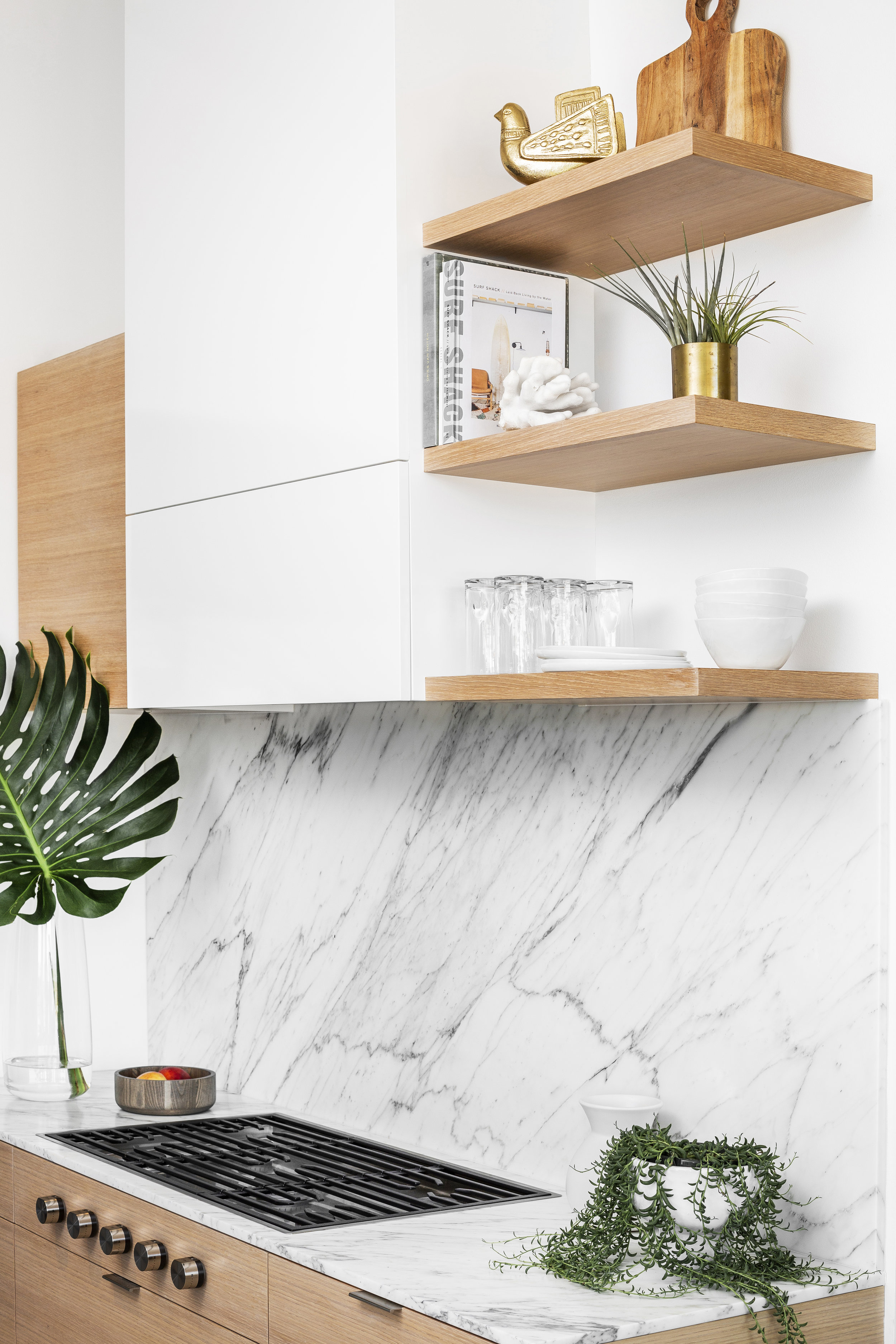 Kitchen materials include Carrara marble and white oak casework.
